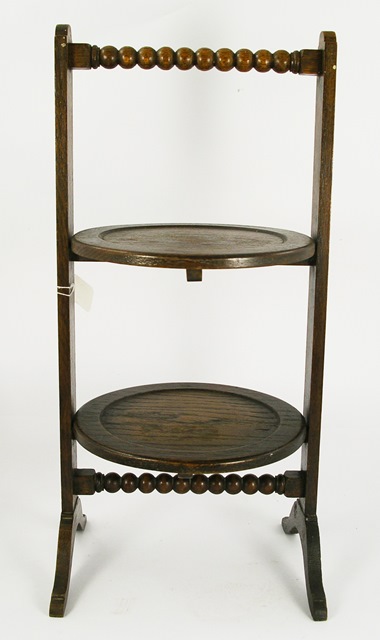 A 1920`S OAK TWO TIER TABLE TOP CAKE/SANDWICH STAND with plain turned trays and bobbin handle, 58cm