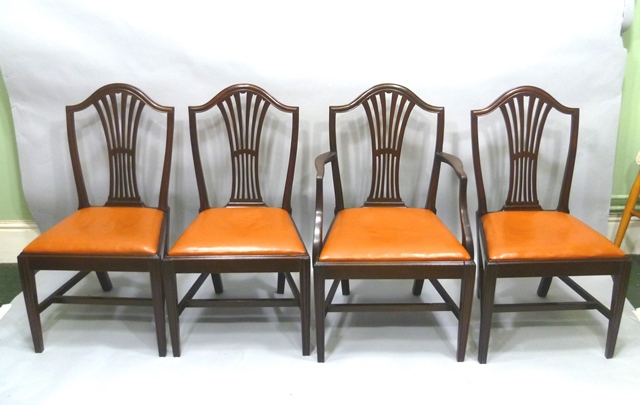 A SET OF FOUR 20TH CENTURY HEPPLEWHITE STYLE MAHOGANY DINING CHAIRS each having hump back crest