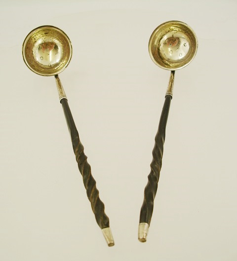 MAKERS MARKS OBSCURED A PAIR OF GEORGIAN SILVER AND WHALE BONE HANDLED TODDY LADLES, each having