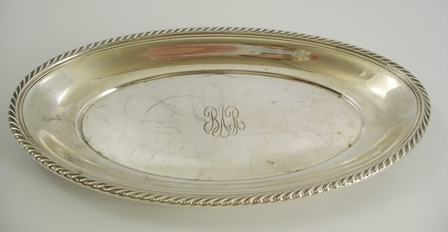 GORHAM MANUFACTURING AN AMERICAN OVAL FOREIGN SILVER COLOURED METAL DISH having pressed gadroon rim