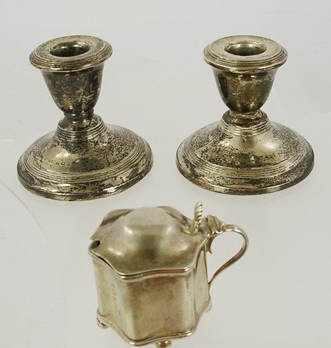 S**S LTD. A PAIR OF SPUN SILVER DWARF CANDLESTICKS, each with integral sconce and loaded base,
