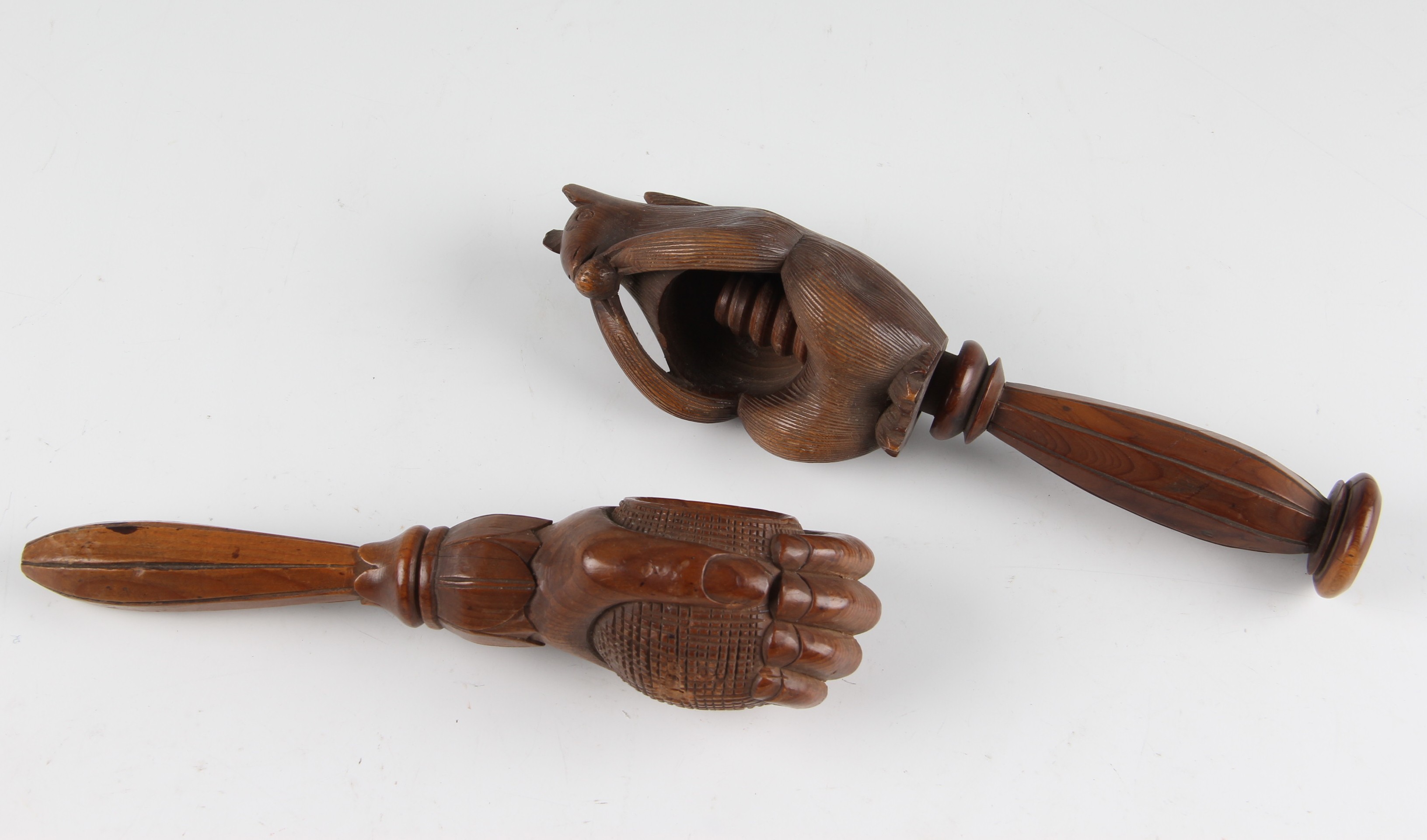 Two 19th Century treen screw type nutcrackers to include one in the form of a squirrel, the other