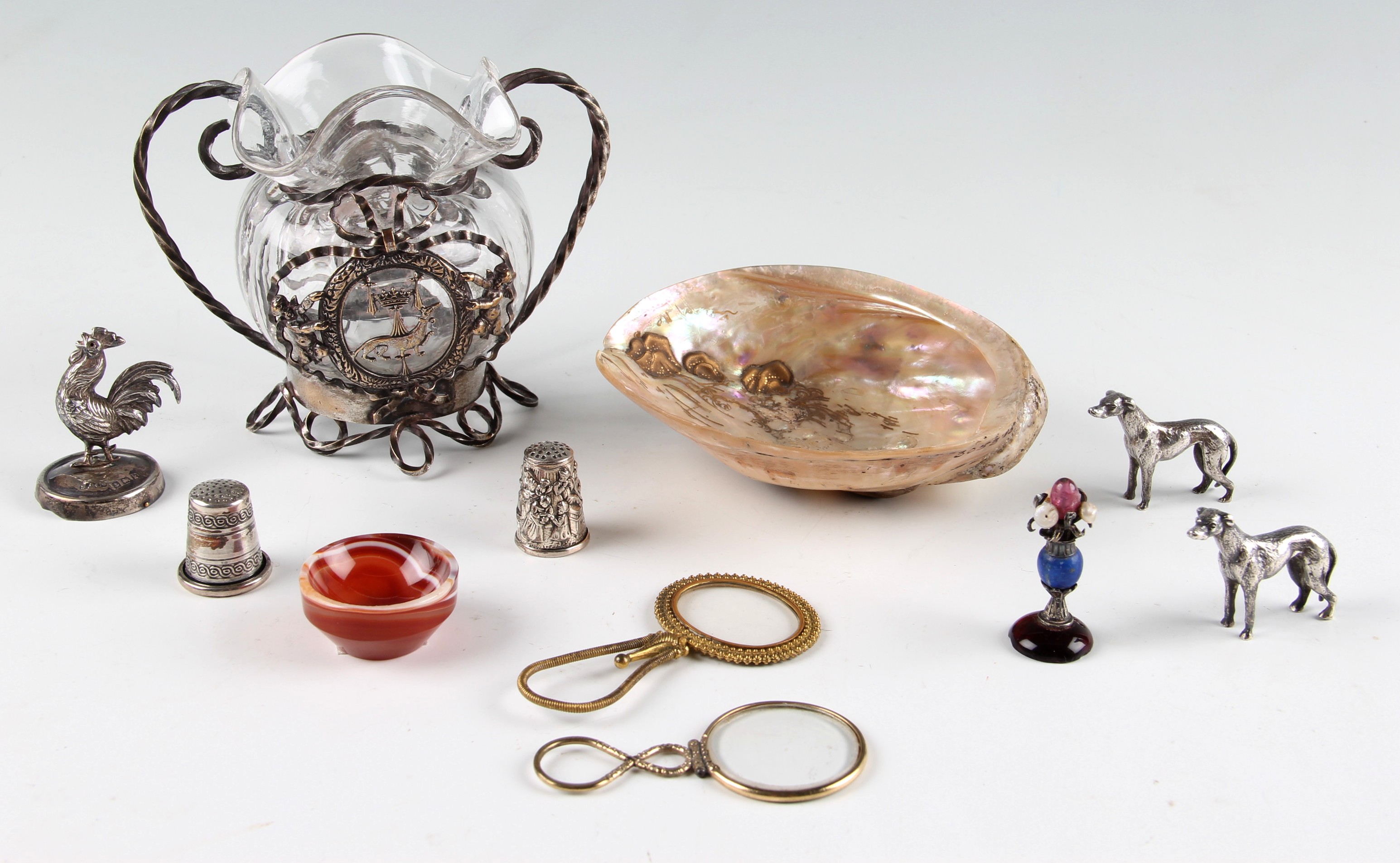 A parcel lot to include two 19th Century gilt magnifying glasses, of quizzing type, Chinese hat