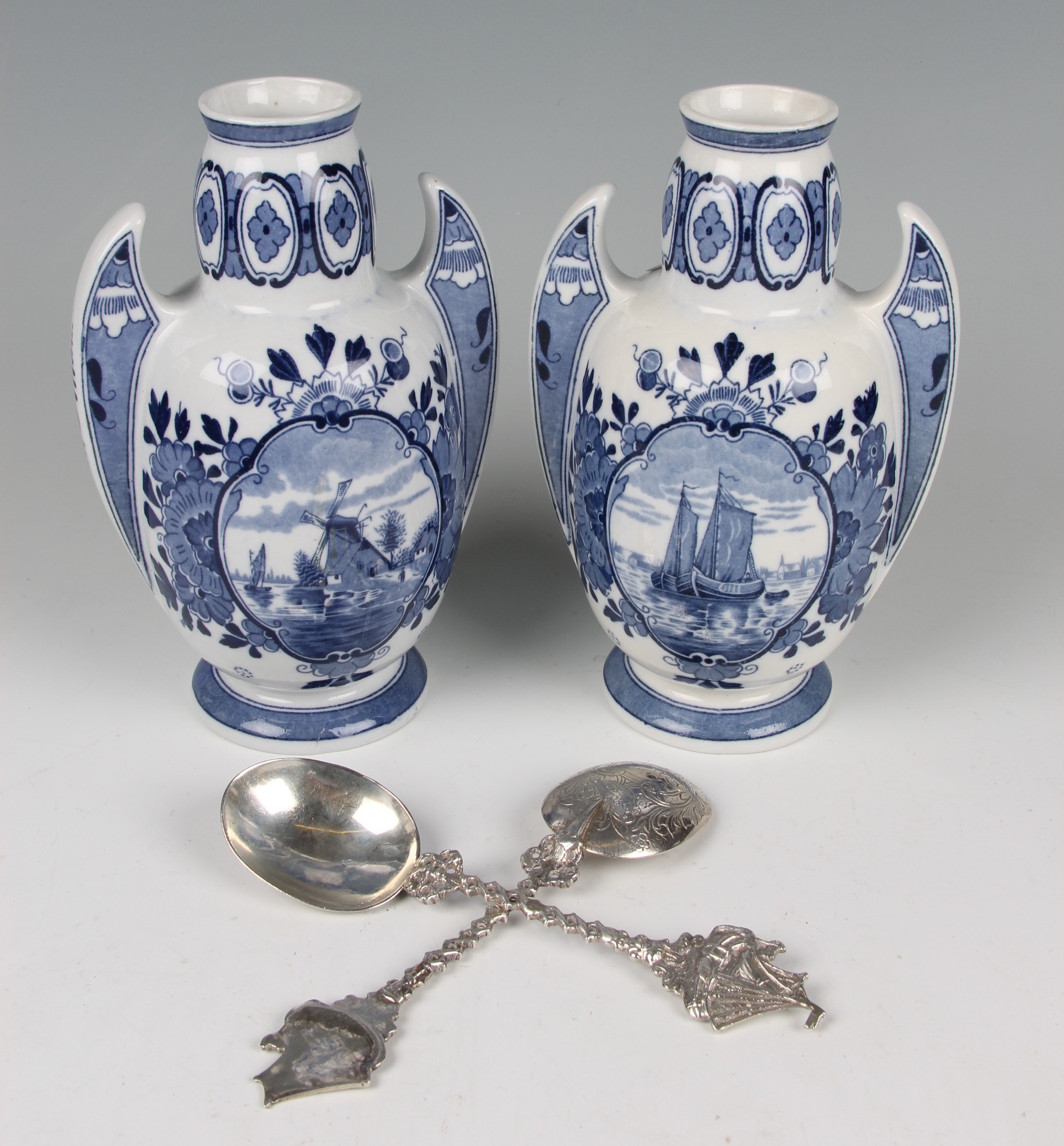 Four items to include a pair of Dutch silver spoons, in 17th Century style with boat finials,