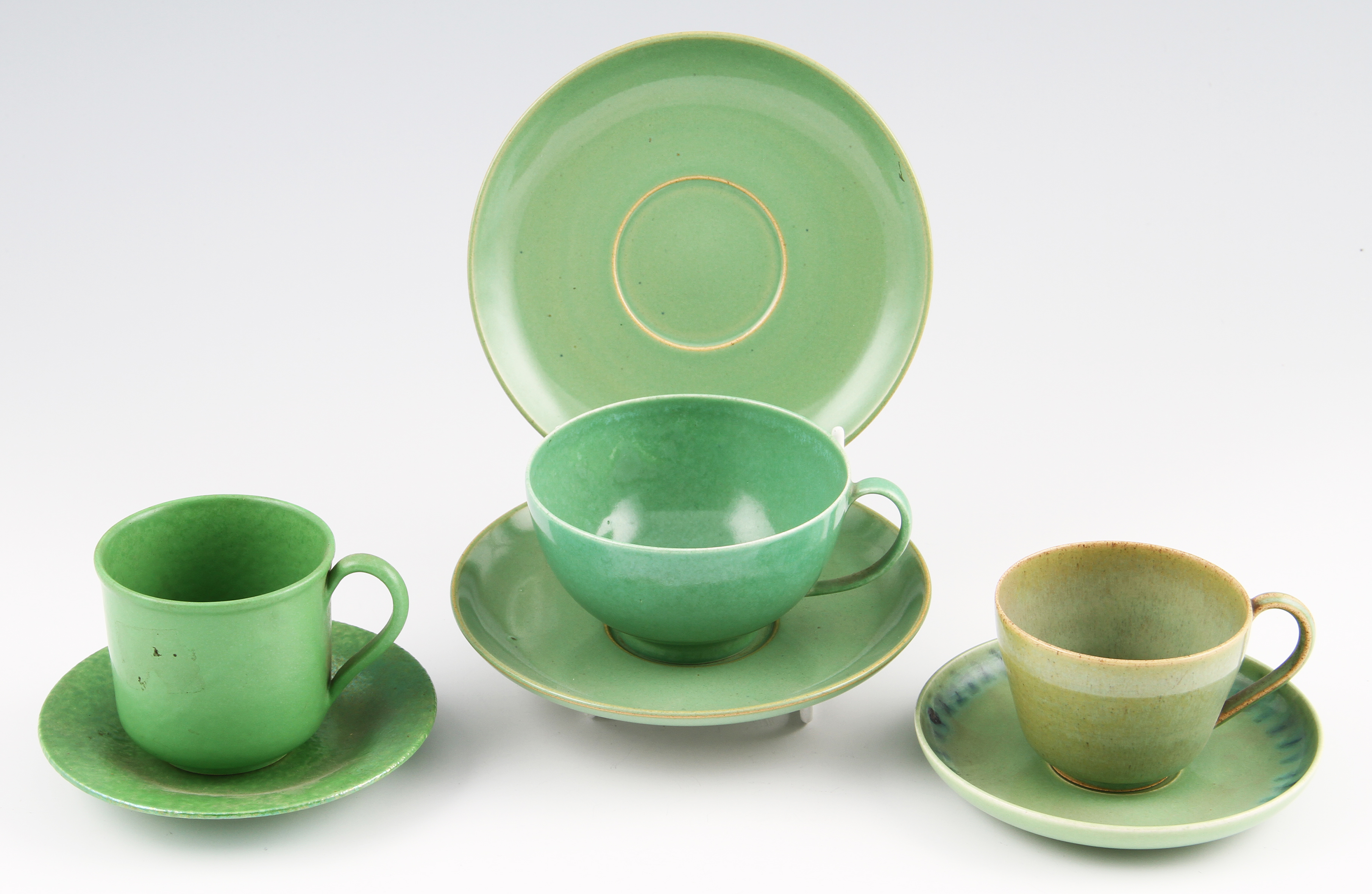 A group of Ruskin Pottery, to include coffee cup and saucer, apple green glaze, cup impressed mark,