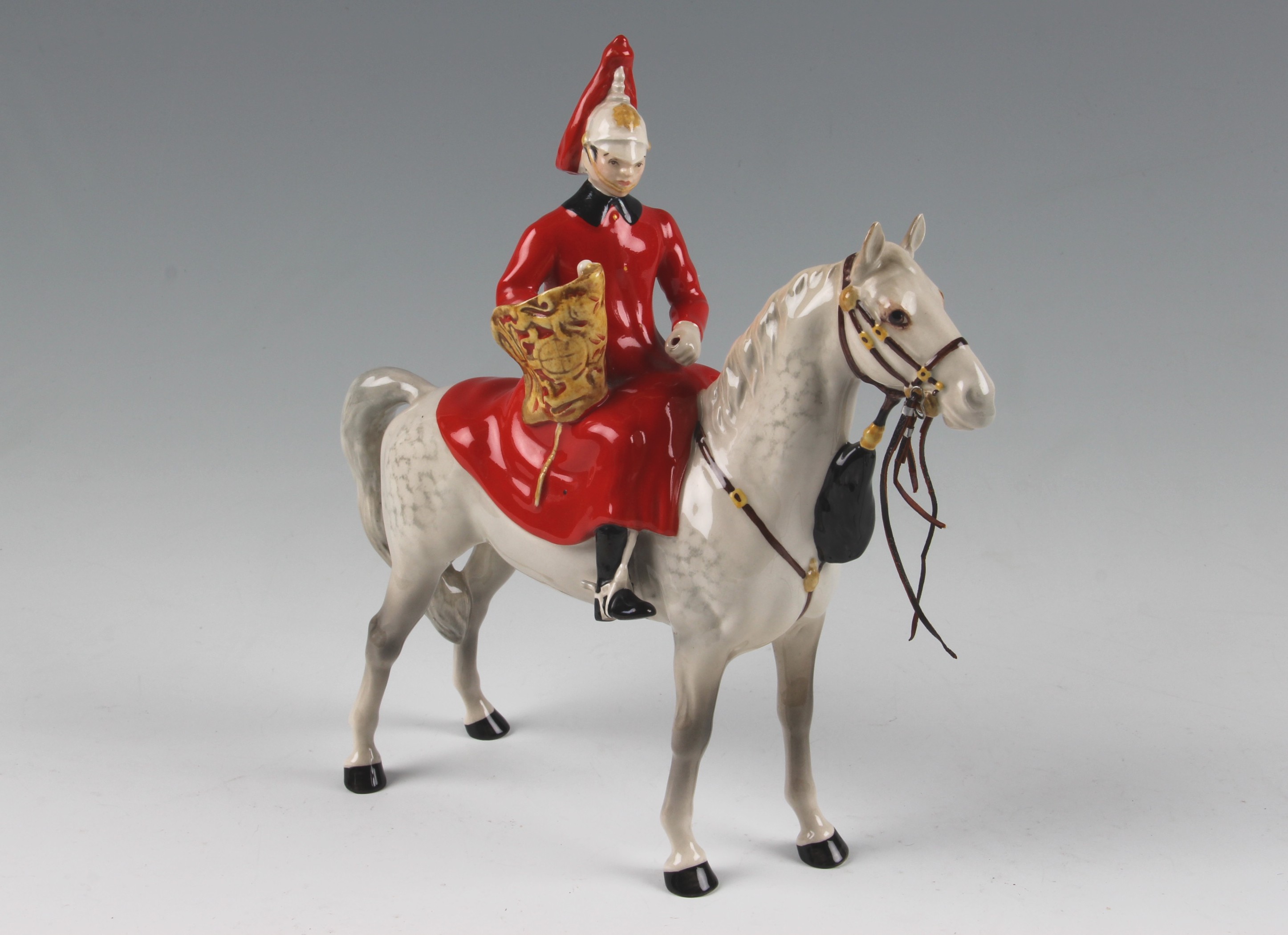 A Beswick figure of a Lifeguard on Horse with trumpet, 1624 by A Gredington, approx. 25cm high.