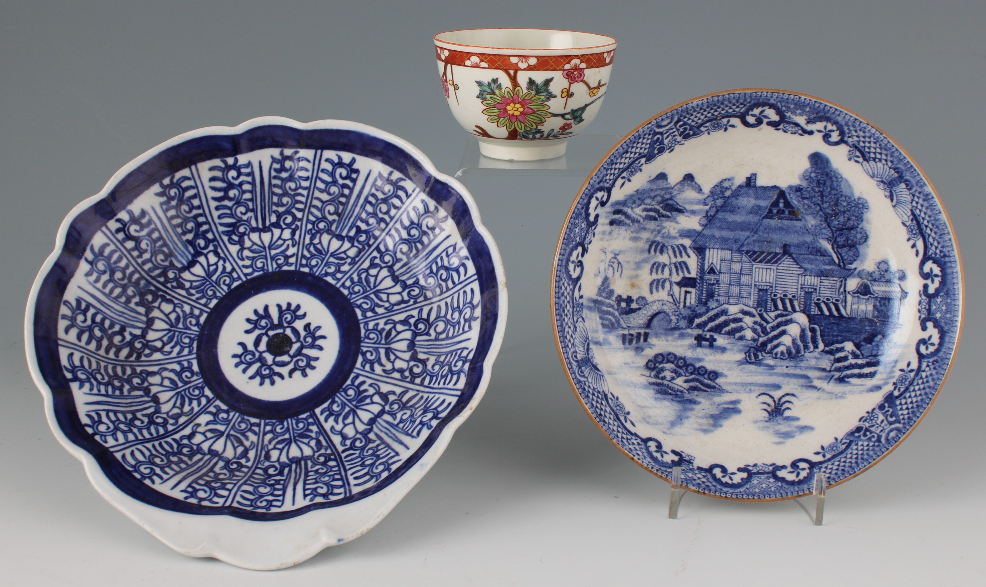 Three pieces of 18th Century English soft paste porcelain to include tea bowl with polychrome