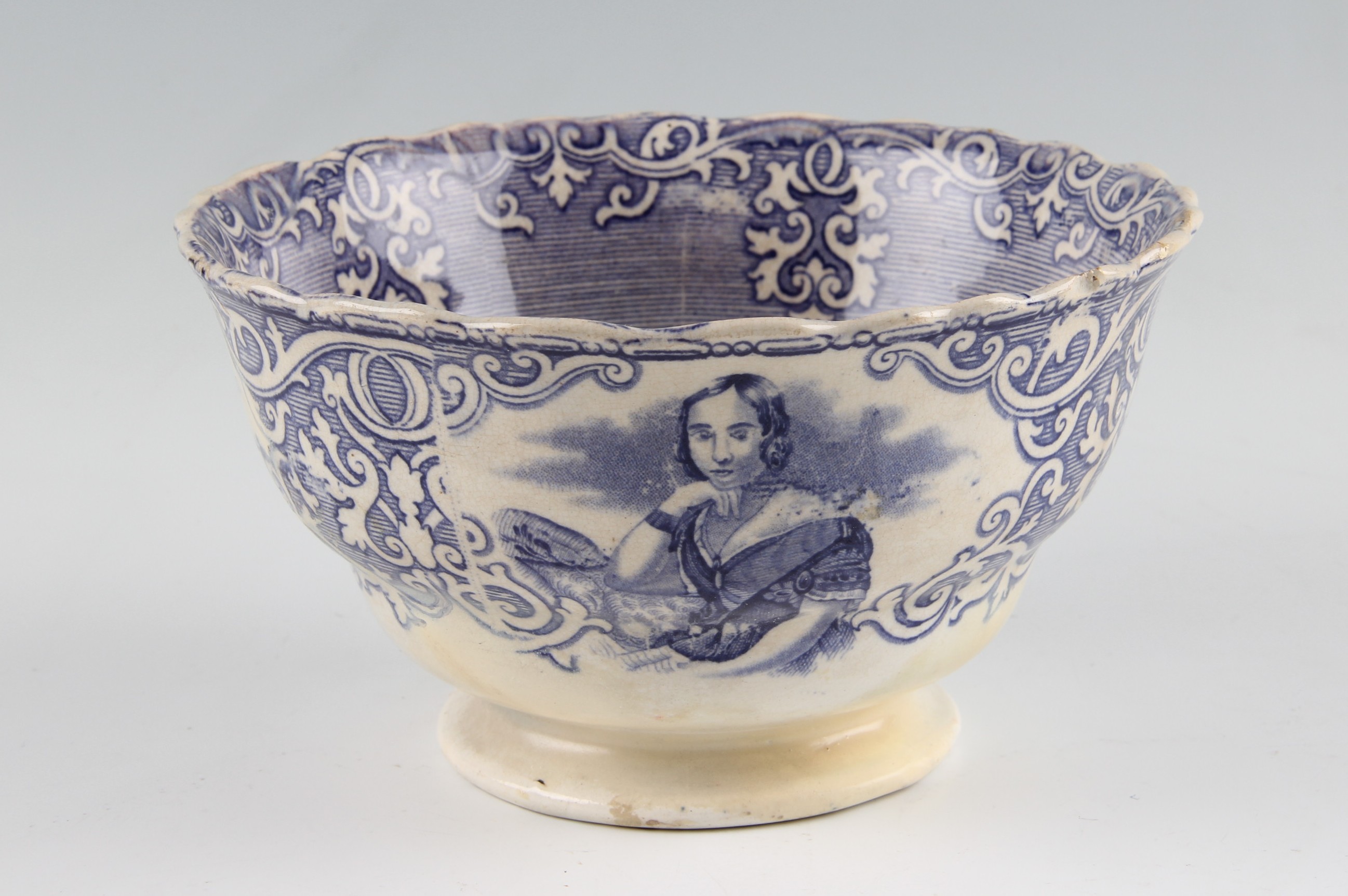 A Staffordshire pottery Royal commemorative bowl, transfer printed with the young Queen Victoria