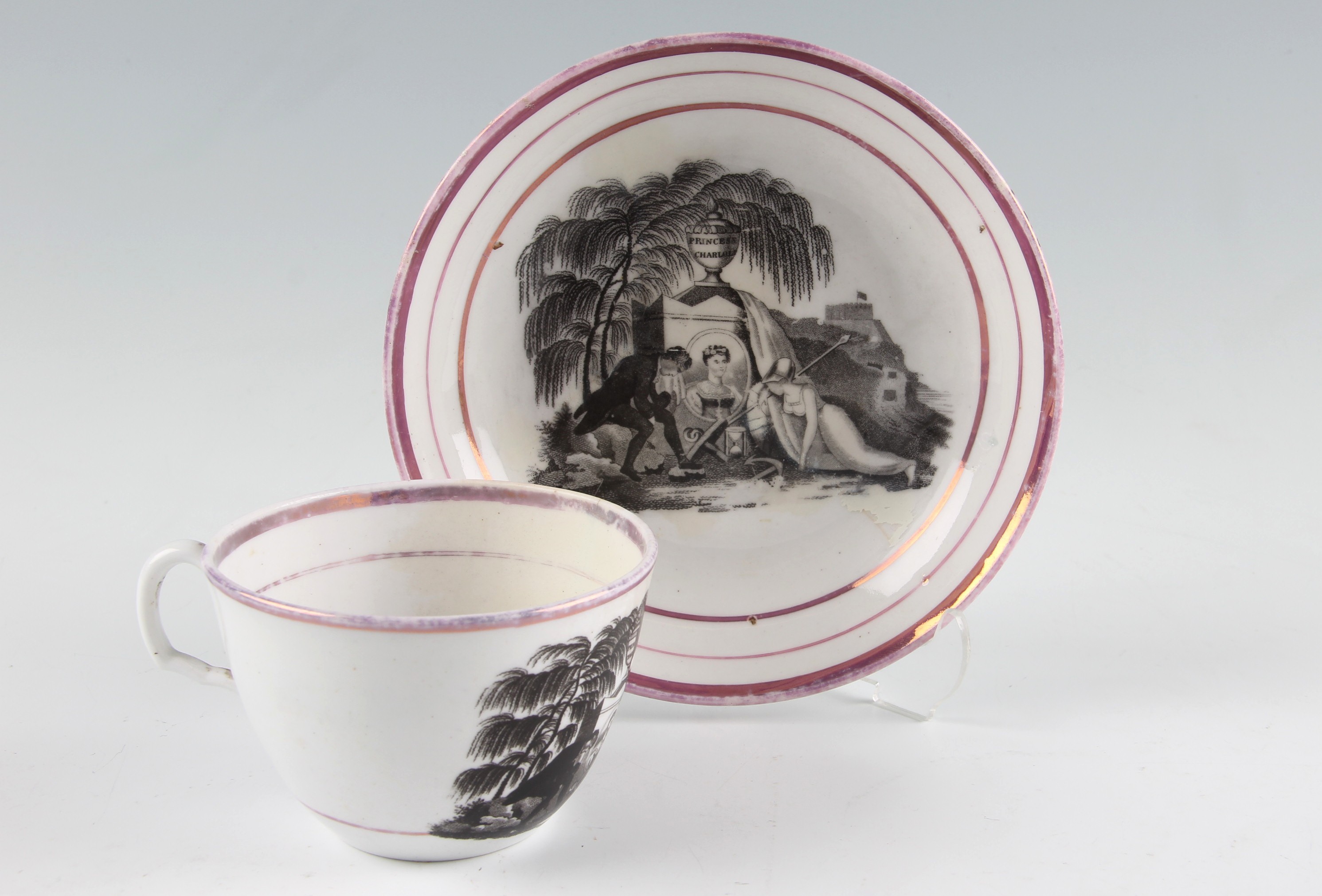 A 19th Century Staffordshire porcelain Royal commemorative teacup and saucer, bat printed in black