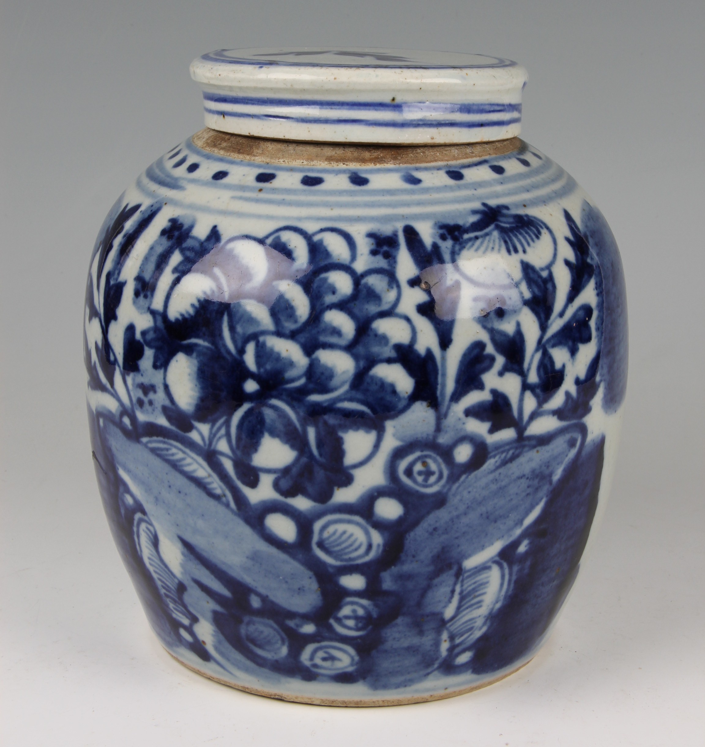 A Chinese export porcelain ginger jar, of baluster form with flat lid, decorated in underglaze blue