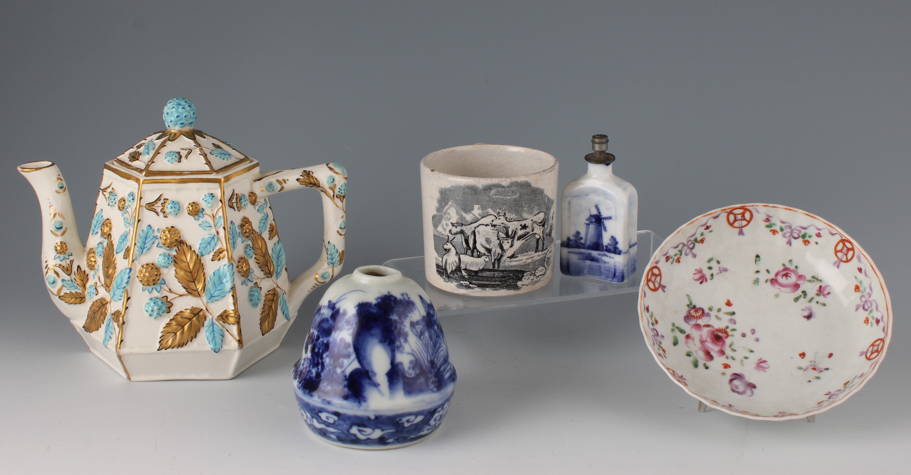 A group of five pieces of ceramic to include a Victorian hexagonal teapot, relief moulded with