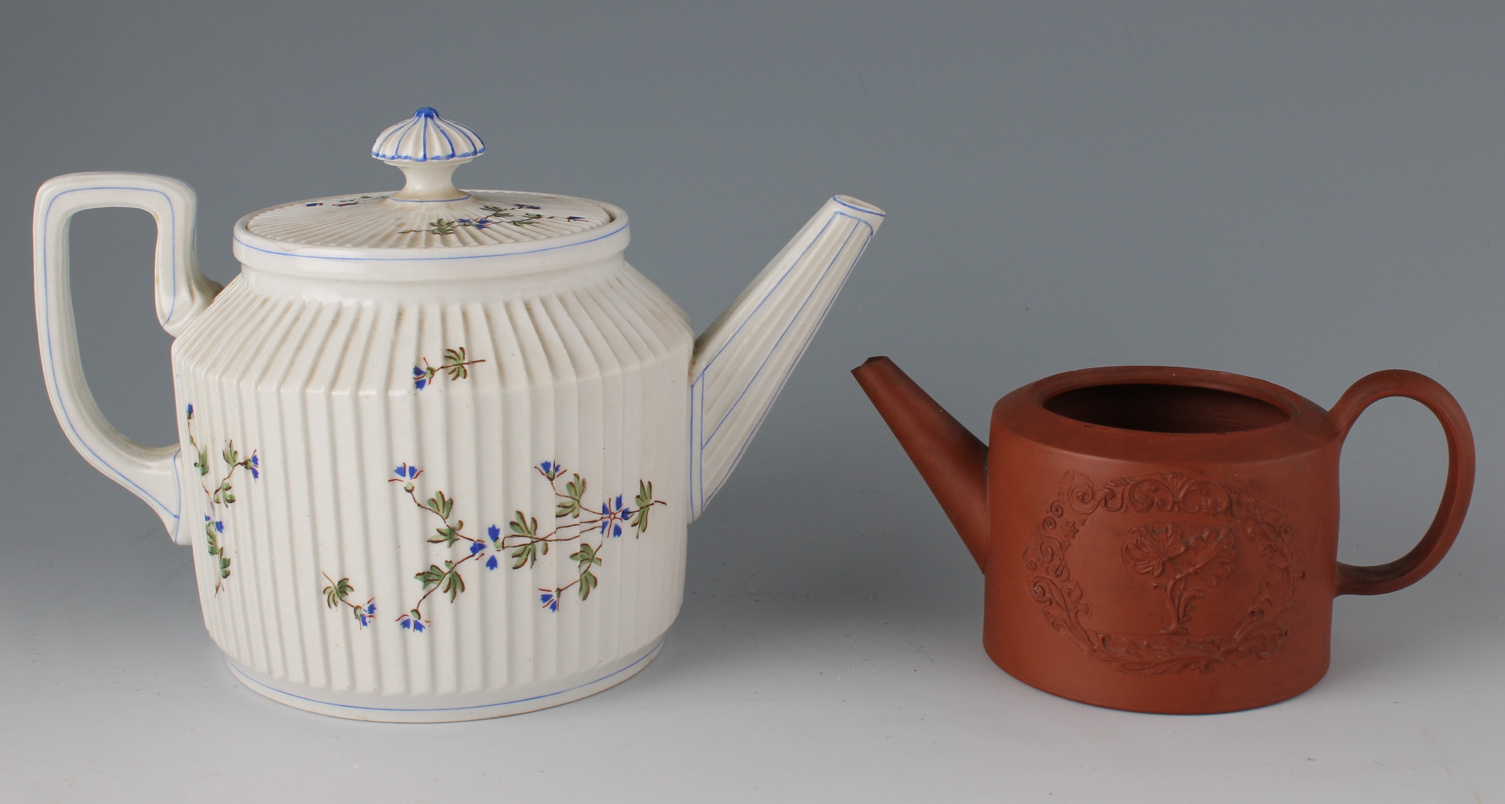 Two teapots to include an early 19th Century hard paste porcelain example, the straight sided