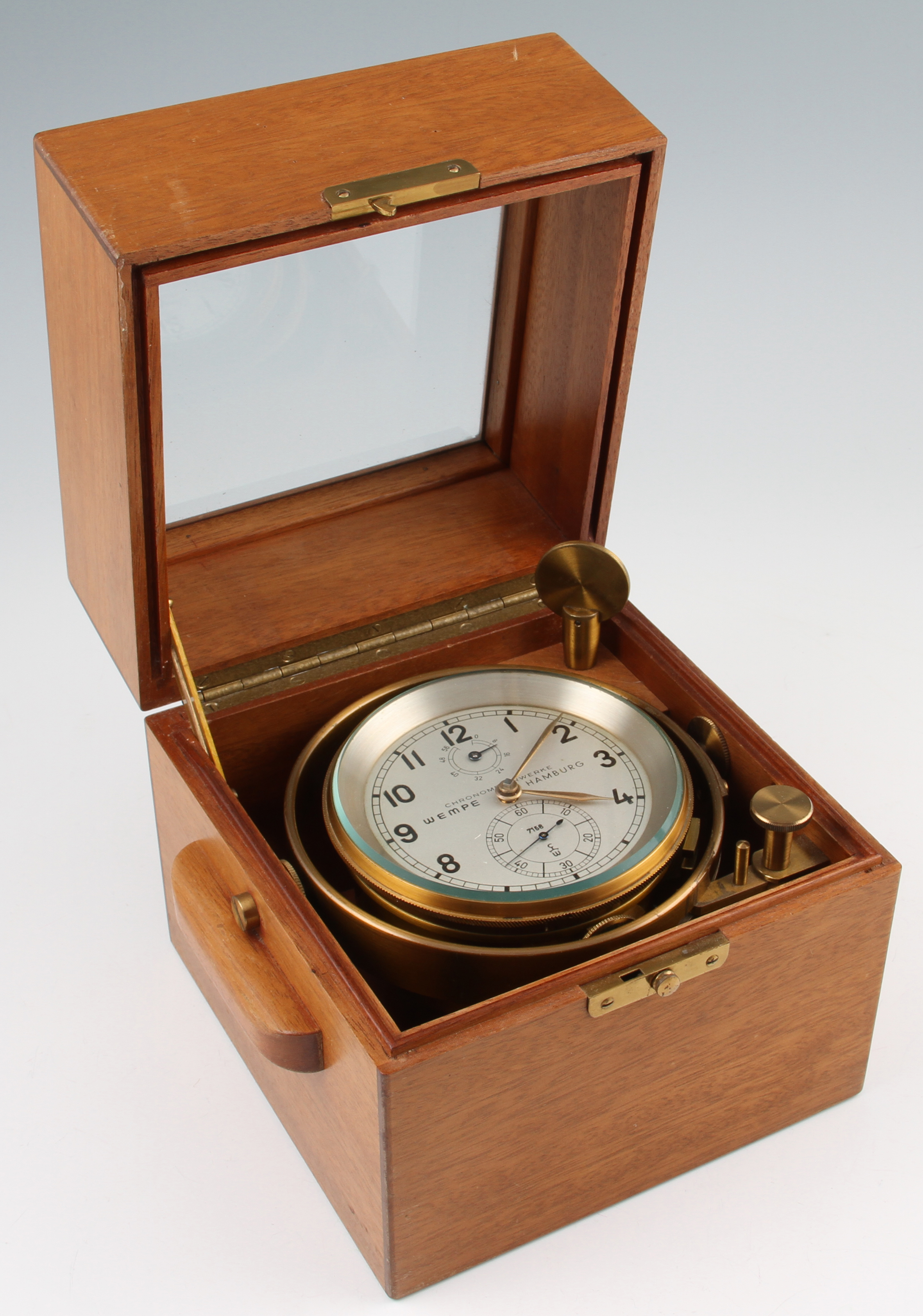 A 20th Century brass marine chronometer, by Wempe Hamburg with a circular subsidiary seconds dial,