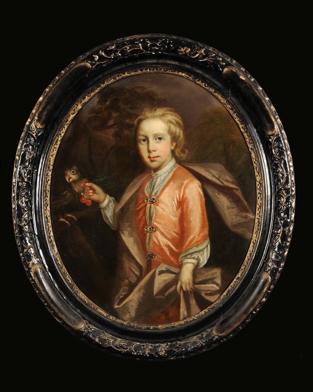 Oval framed, unsigned, 18th Century oil on canvas, three quarter length portrait of a boy in orange