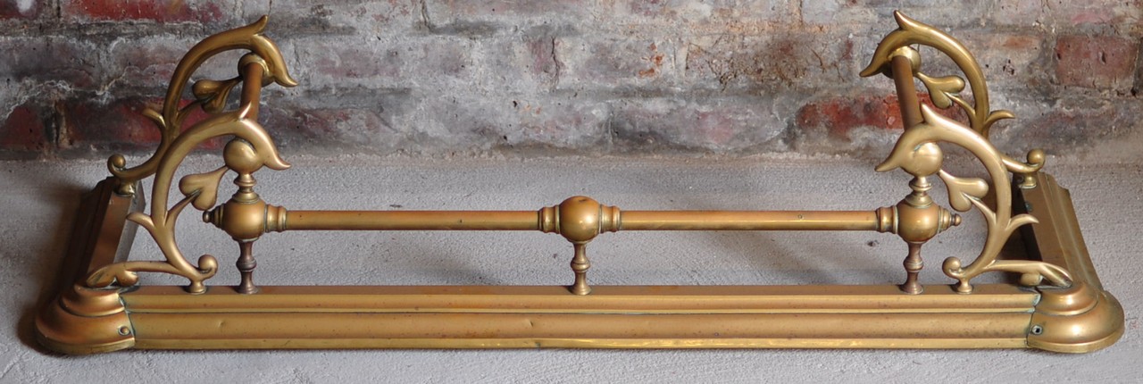 A late Victorian brass Fender of Art Nouveau design, 4` (122cms) wide.