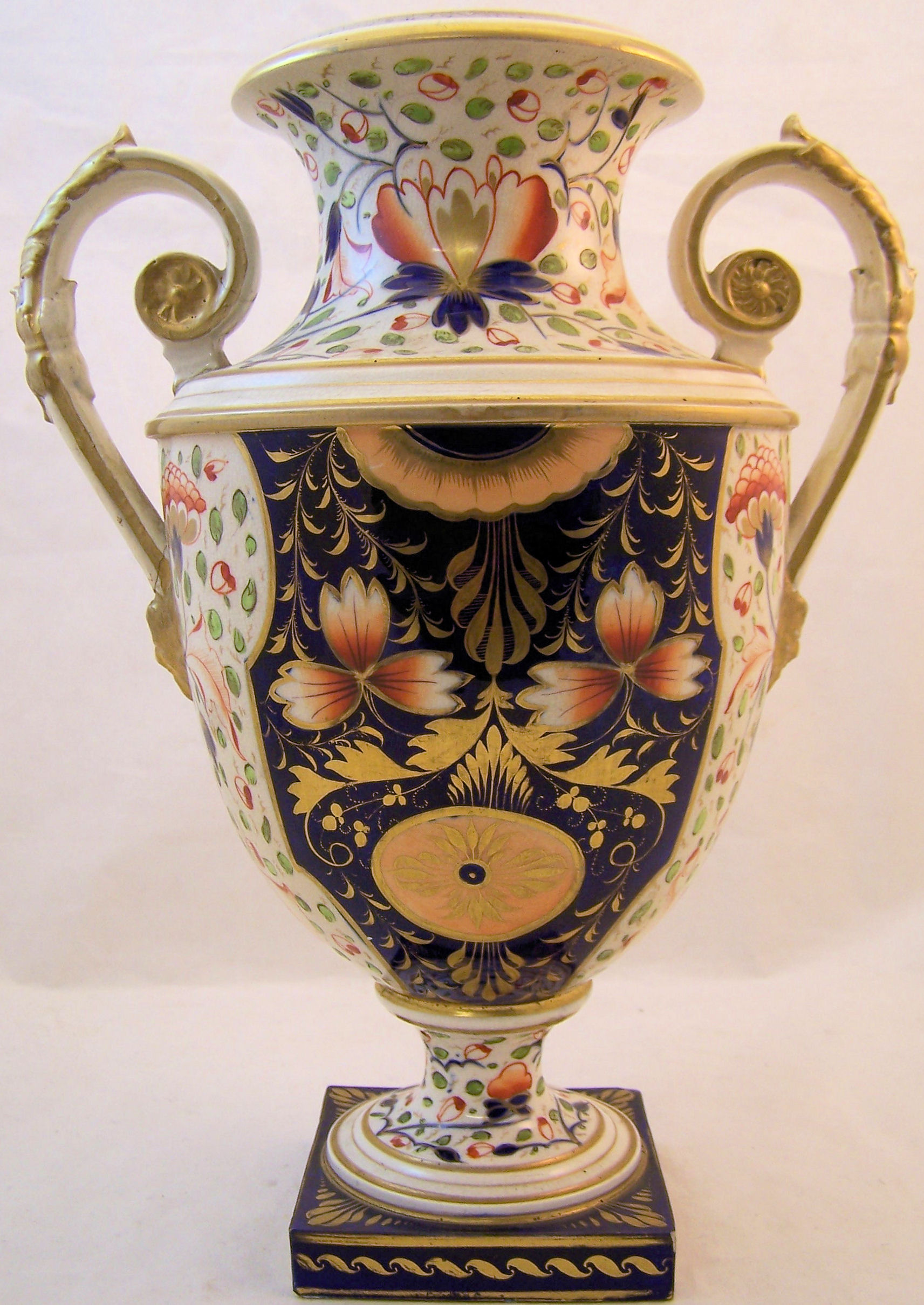 An early 19th Century Derby two handled Vase of baluster form painted with sprays of flowers in