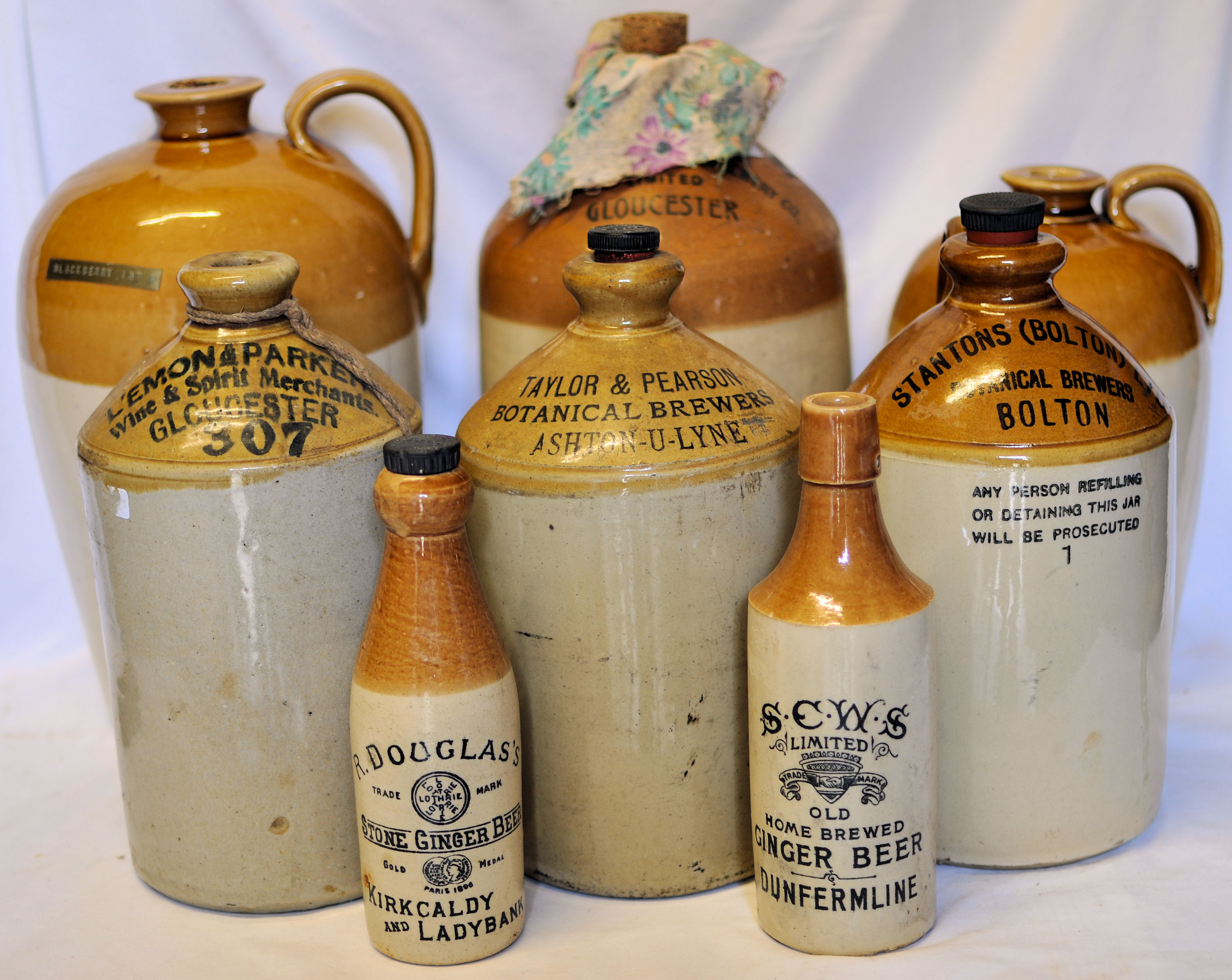 A Stoneware Jar for the Cheltenham Brewery Company, another for Taylor & Pearson, Ashton under Lyne