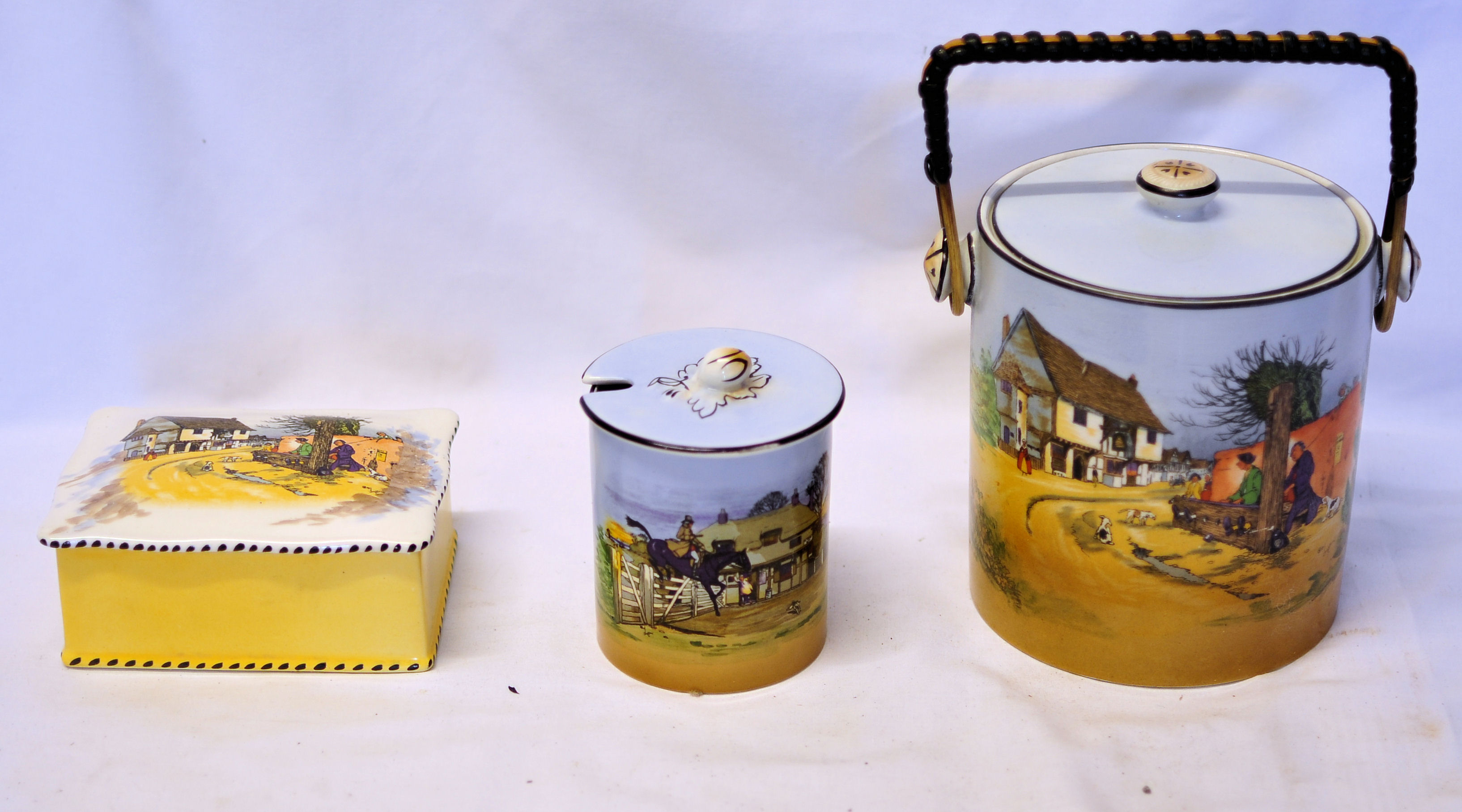 A cylindrical Biscuit Barrel and cover with wound handle, cylindrical preserve jar and cover with