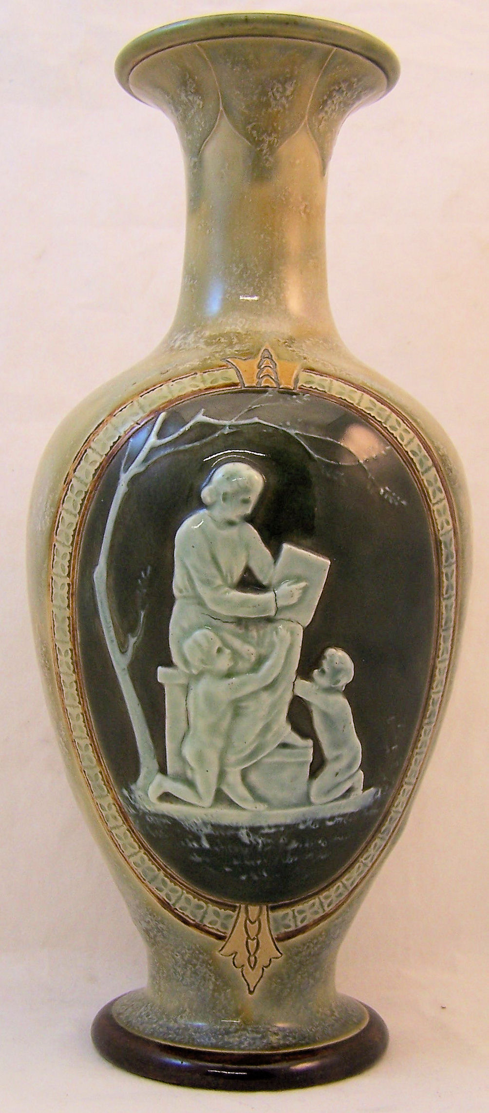 A Doulton Lambeth baluster Vase decorated with an oval low relief cameo panel of a female figure