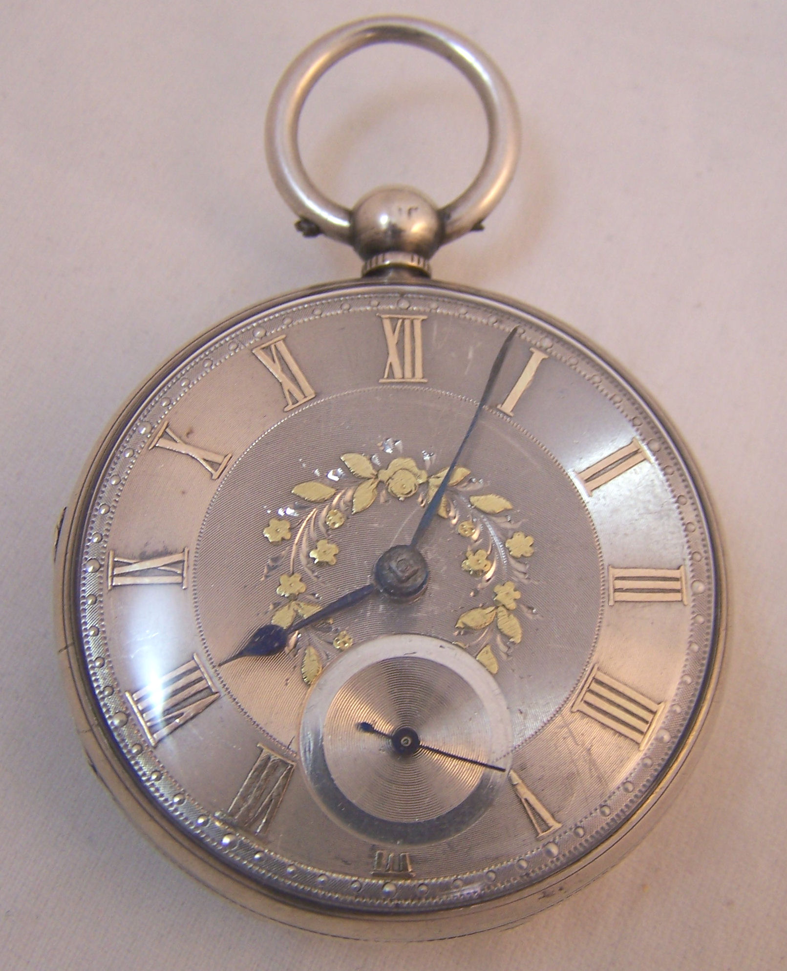 A gentleman`s Victorian open faced Pocket Watch with silvered dial and subsidiary seconds dial in