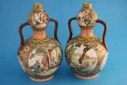 A pair of 20th century Chinese Canton enamelled vases of double gourd form with two handles