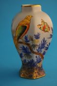 A Carlton Ware "Bird on the Bough" patterned octagonal vase on a pale blue ground, decorated with