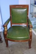 A pair of Empire style open armchairs with green leather padded back and seat and arms, with gilt