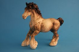 A Beswick Cantering Shire in rocking horse grey, printed mark number 975.