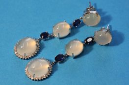 A pair of 18ct white gold moonstone, sapphire and diamond drop earrings.