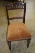 A set of six Edwardian mahogany dining chairs with overstuffed seats and supported on turned legs.