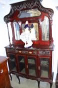 A Victorian mahogany mirror back side cabinet with carved frieze below four glass panels, the base