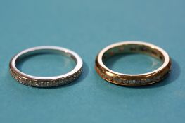 A white gold diamond half hoop eternity ring and a gold full eternity ring. (2)