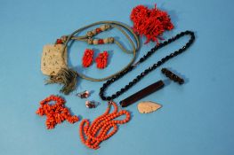 A Jade pendant, various coral necklaces etc.