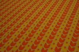 A roll of fabric, The Danasco Collection `Tulip` pattern, having rows of alternate yellow and orange