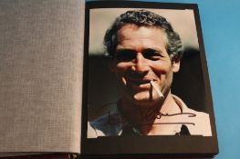 A photo album containing signed photos of: David Suchet, Warrick Davies, Bruce Forsyth, John Hurt,