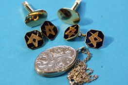 A pair of 9ct gold `Masonic` cufflinks, a pair of 9ct gold oval cufflinks, weight 16.9 grams and