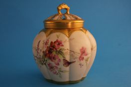 A Royal Worcester pot pourri jar and cover decorated overall with flowers and butterflies, printed