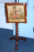 A Victorian barley twist pole screen with an embroidered panel.