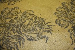 A `Burning Bush` Edinburgh Weavers part roll of woven fabric on a beige ground having beige floral