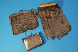 Two silver chain link purses and another silver purse.