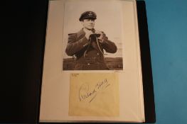 A folder of signatures mounted with photographs of: Richard Todd, Benny Hill, Eli Wallach, The Two