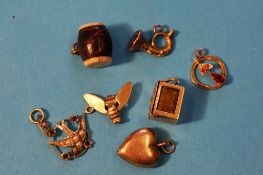 Seven various charms.