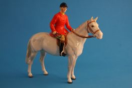 A rare Beswick model of a huntsman on a white horse, printed mark number 1501.