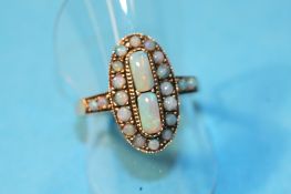 A Victorian 9ct gold and opal ring.