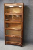 A mahogany globe style five tier stacking bookcase. 87 cm wide