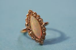 A 9ct gold opal and cubic zirconia ring.