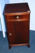 A pair of reproduction mahogany "Jenners" bedside cabinets with single drawer and cupboard below,