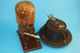 A 19th century French hat measurer by Allie-Maillard of Paris and a beechwood hat stretcher.