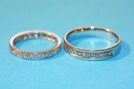 Two diamond eternity rings.
