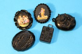 A Victorian jet `Memorial` brooch, two jet lockets and two brooches decorated with classical